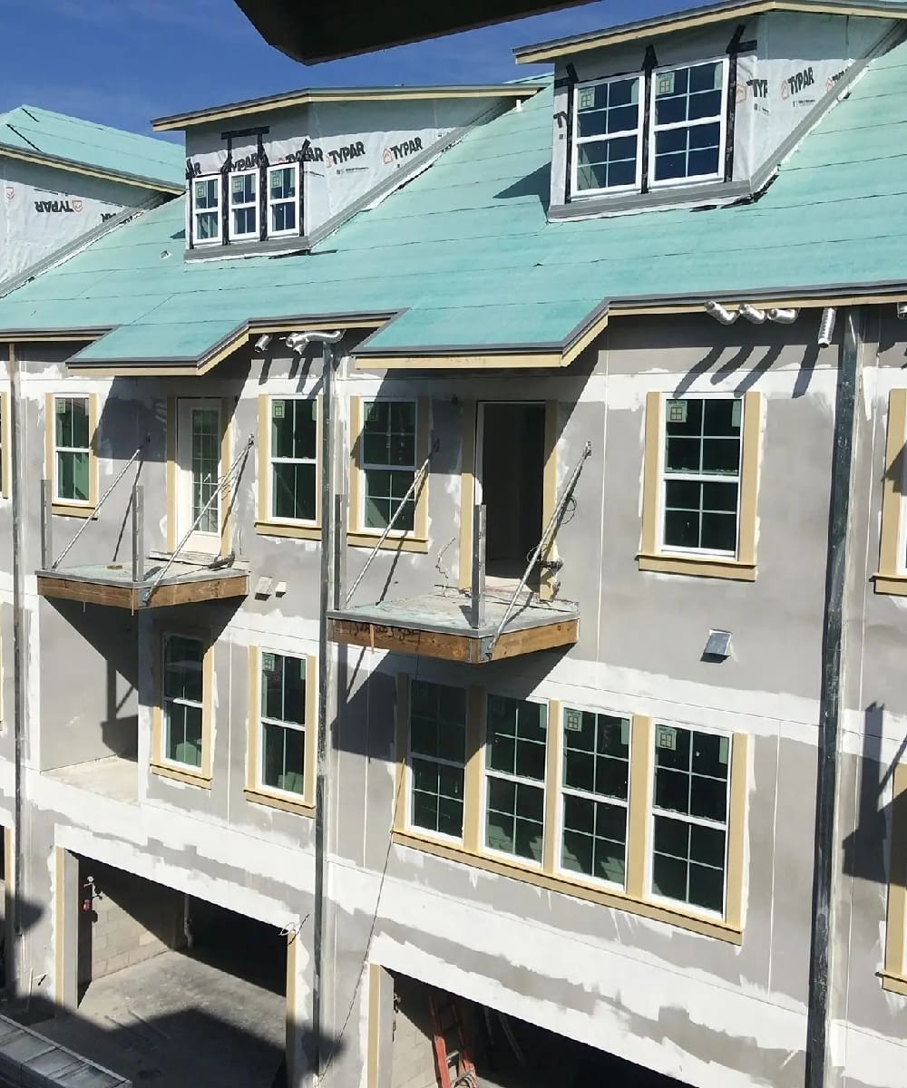 A building with green roof and windows