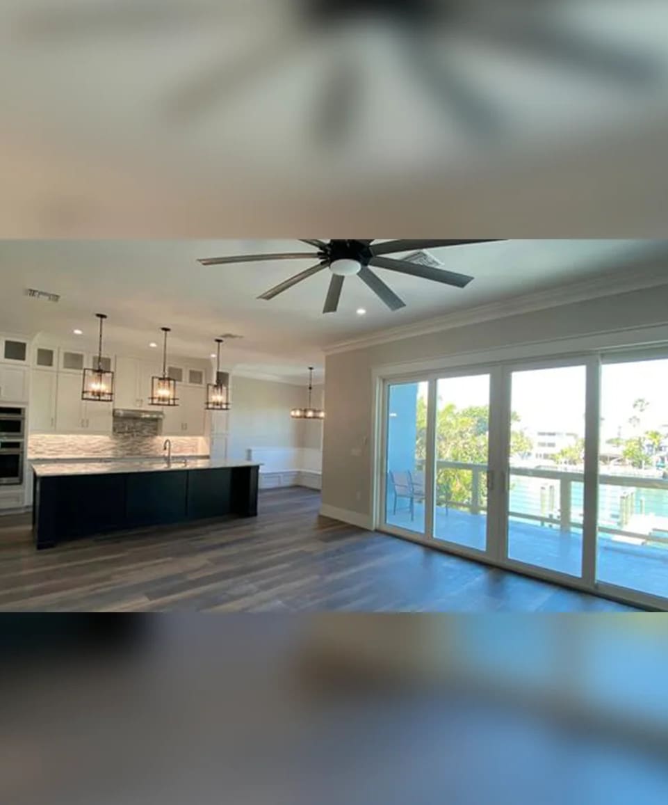 A large open kitchen with sliding glass doors.